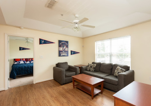 a living room with a couch and a table