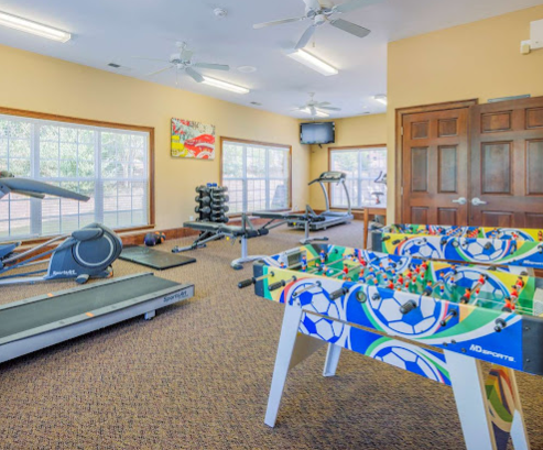 a room with a few exercise equipment