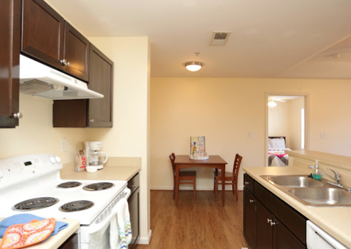 a kitchen with a table and chairs