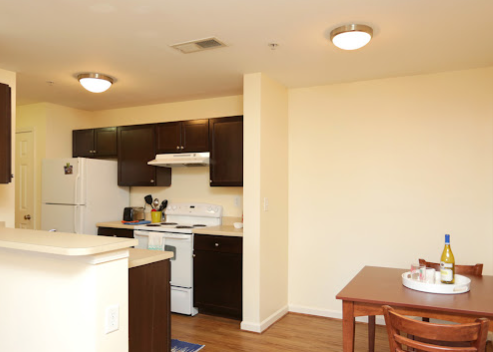 a kitchen with a table and chairs