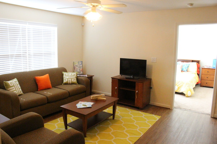 a living room with a couch and a tv
